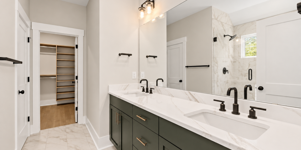 The Kitson primary bath with green double vanity