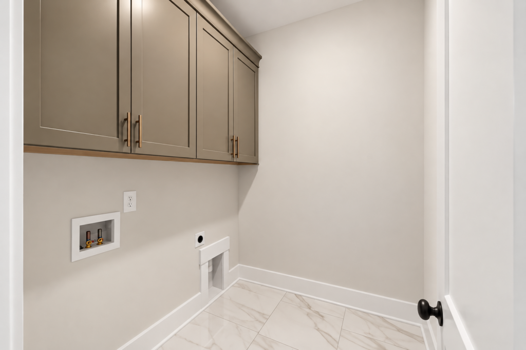 Laundry room with taupe cabinets