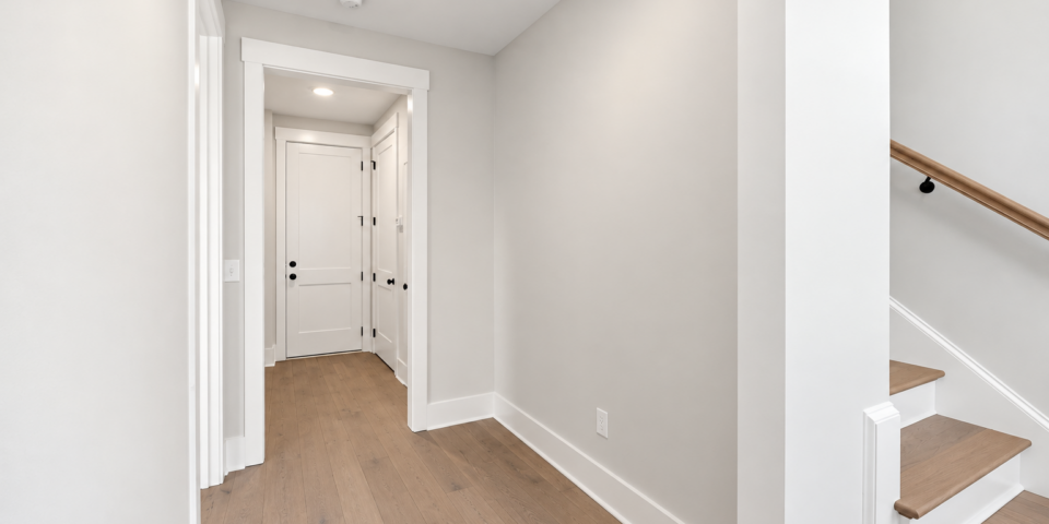 The Kitson upstairs hall with hardwood stairs